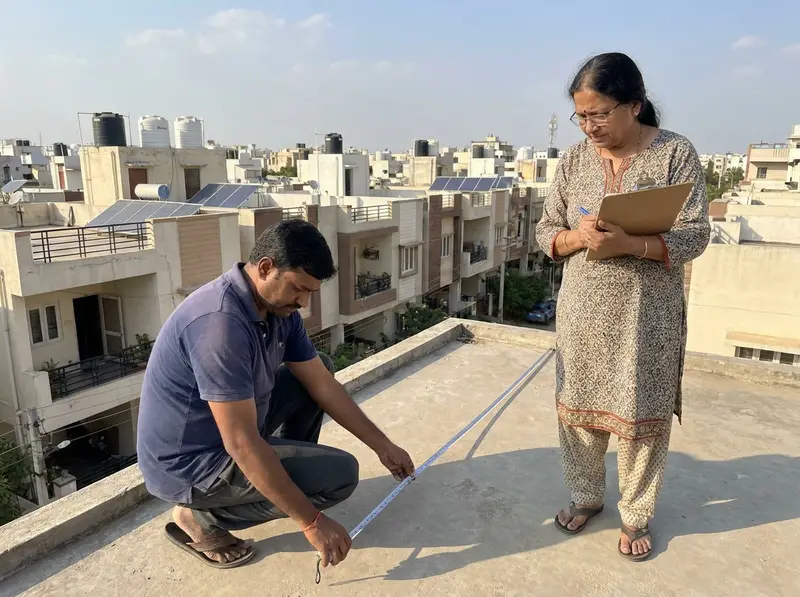 Solar surveyor measuring a house terrace during a free site visit